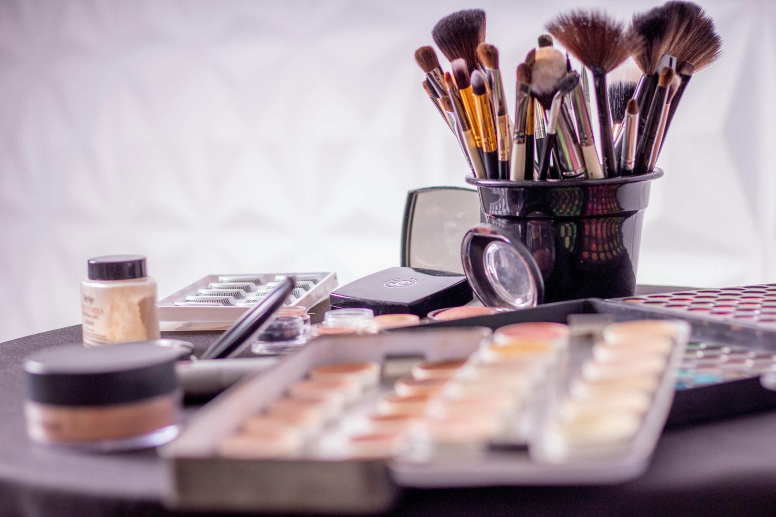 A vareity of cosmetics and make-up brushes