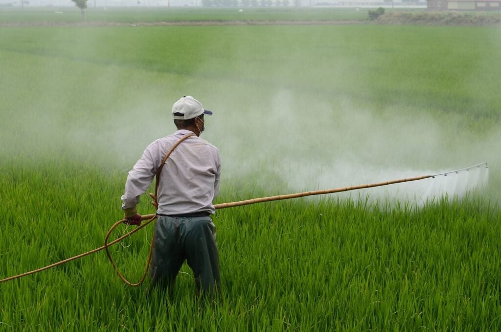 Man spraying a field.
