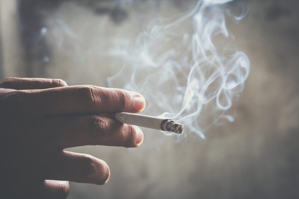 hand holding a cigarette