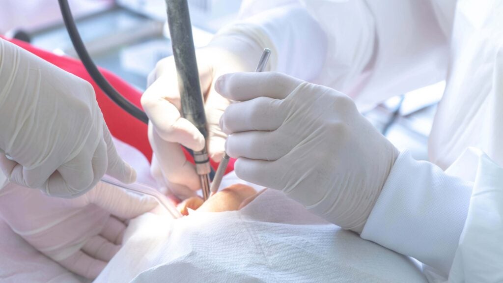 Dentist doing work on patient.