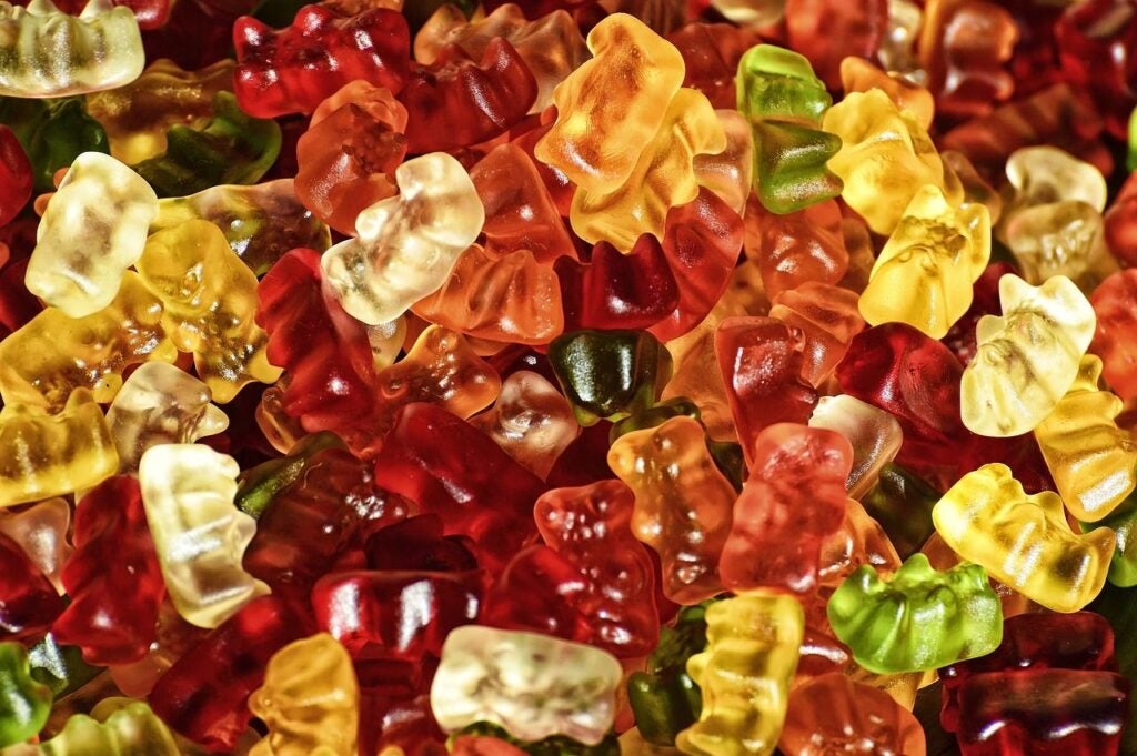 A pile of gummy bears in various colors