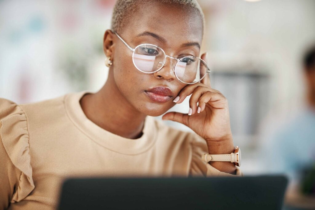 Woman looking at laptop